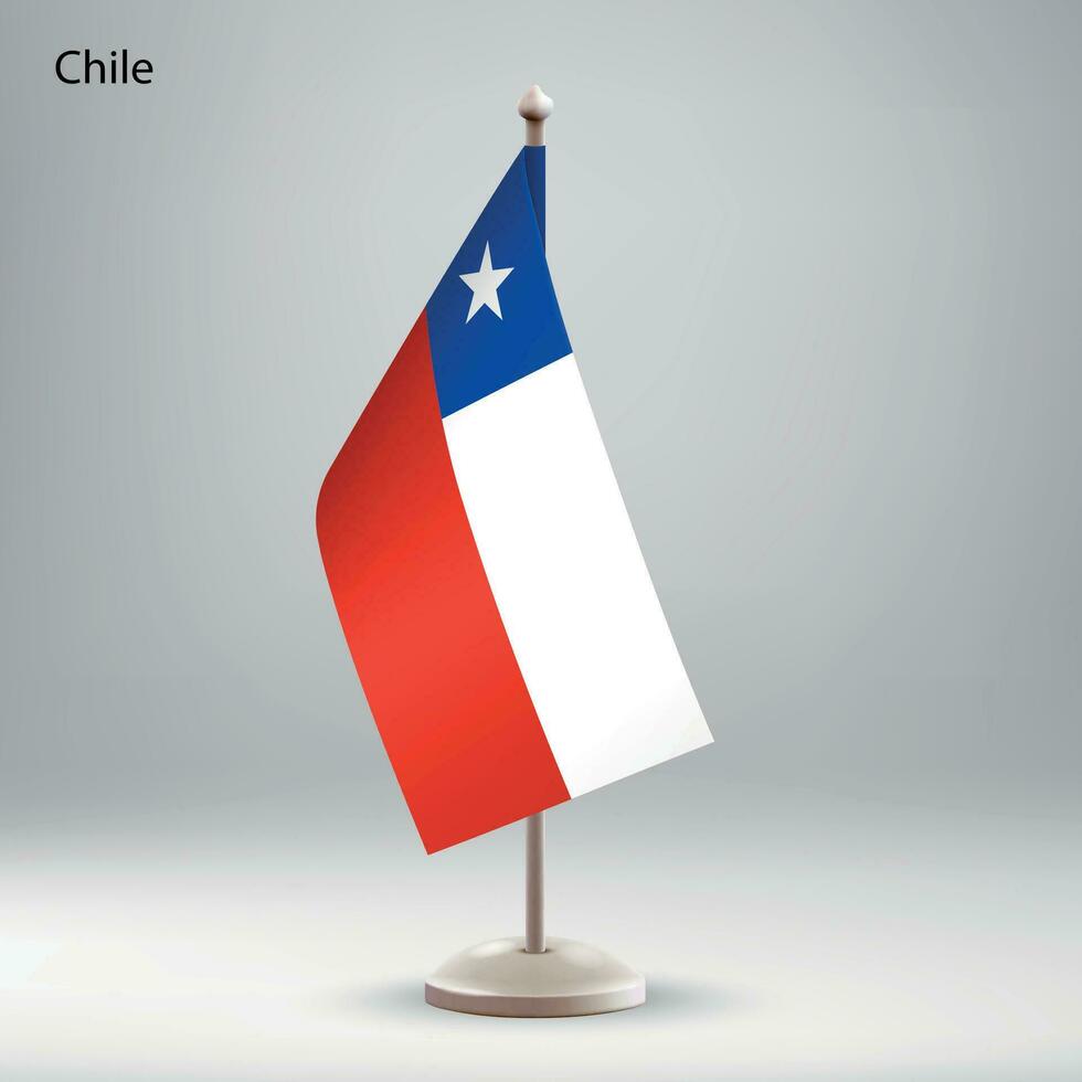 Flag of Chile hanging on a flag stand. vector