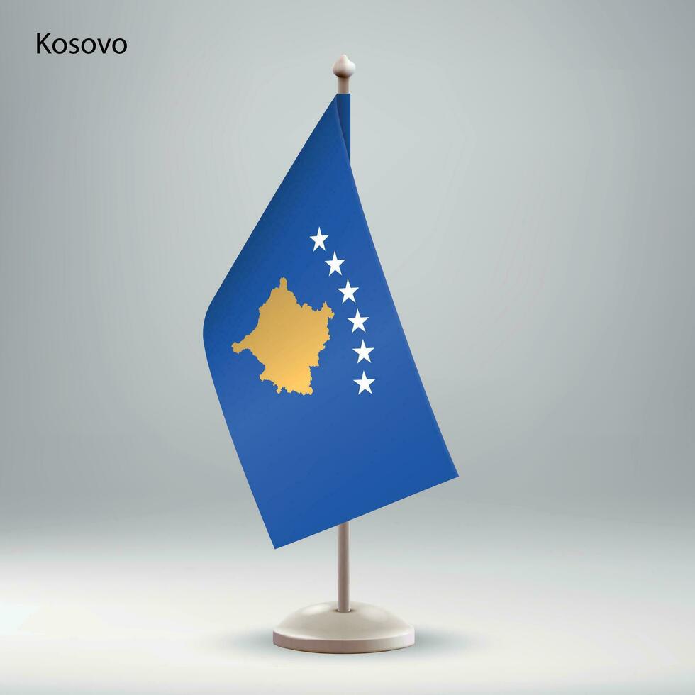 Flag of Kosovo hanging on a flag stand. vector