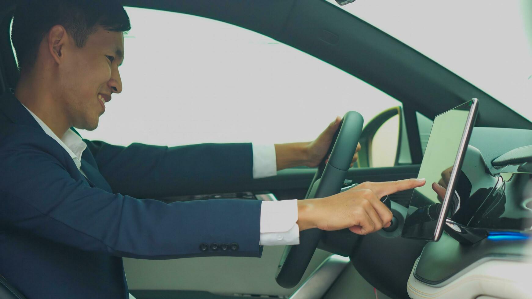 Asian businessman check the electrical system car before buying new electric vehicle. photo