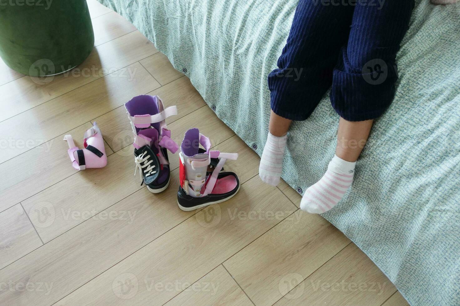 Child cerebral palsy disability, legs orthosis. photo