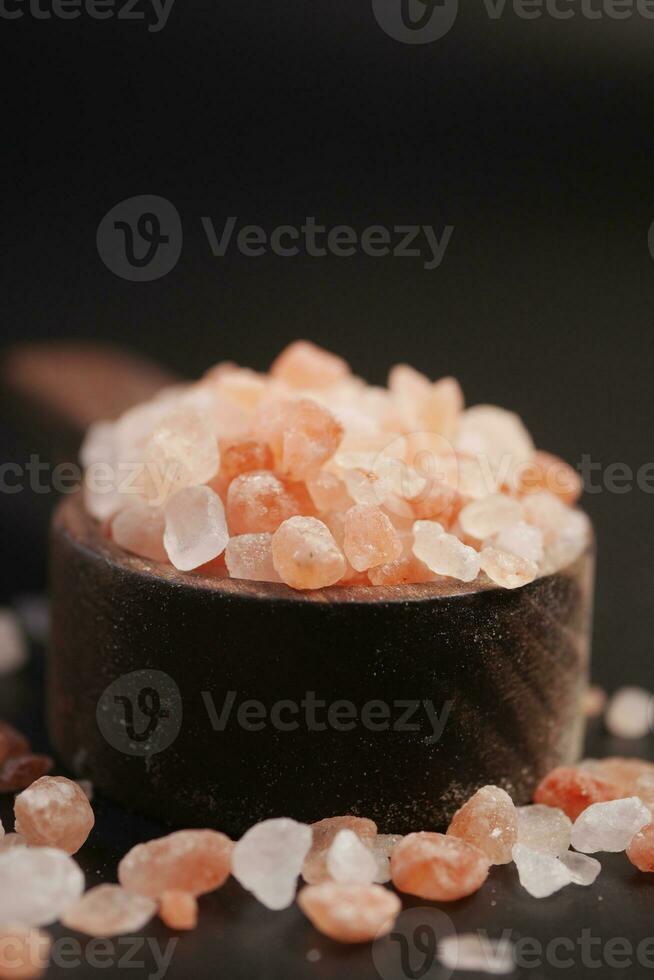 Raw dried pink Himalayan salt in a spoon photo