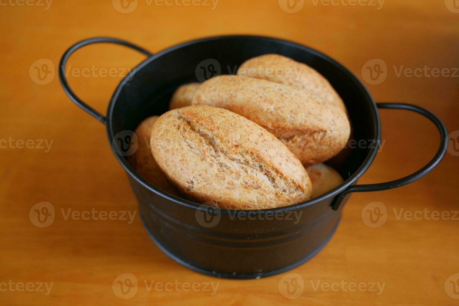 baked bun in a bowl on table photo