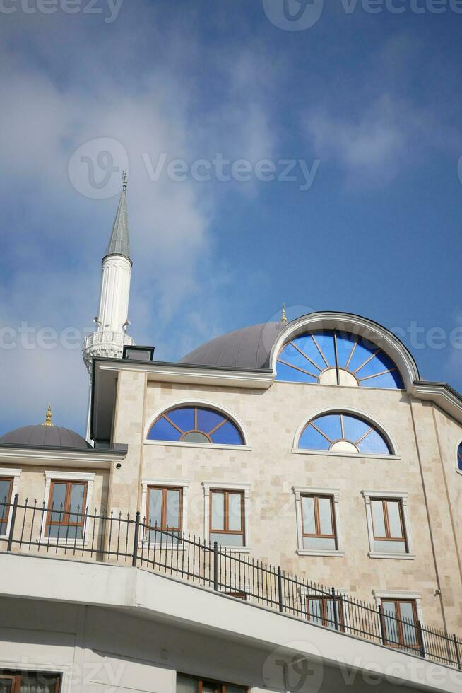 the dome of a mosque against blue sky in istanbul photo