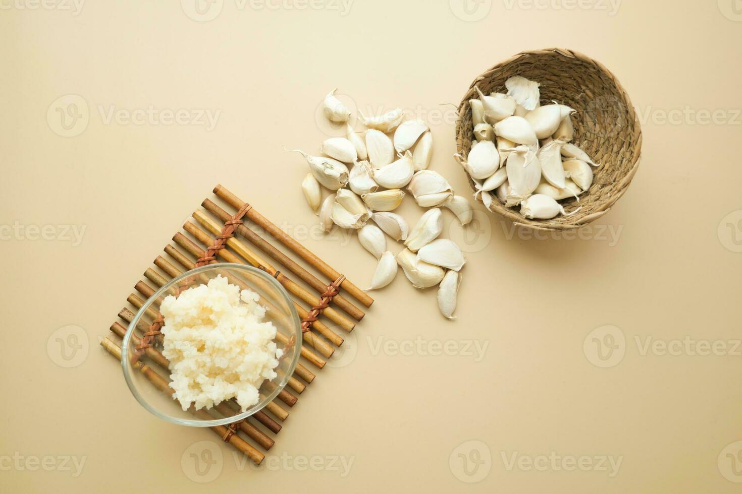 top view of minced garlic in a bowl on table photo
