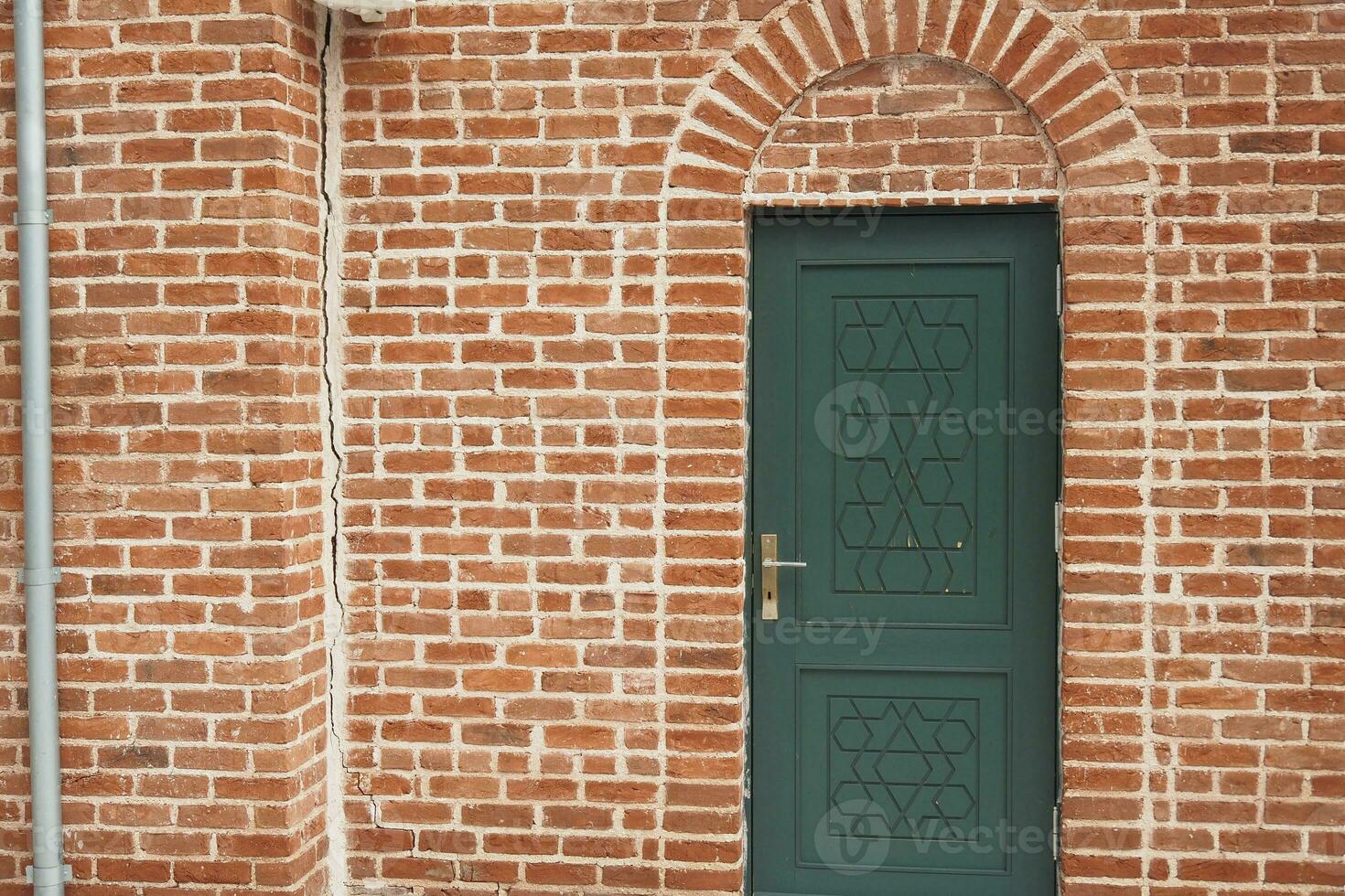 wood door texture background on brick wall photo