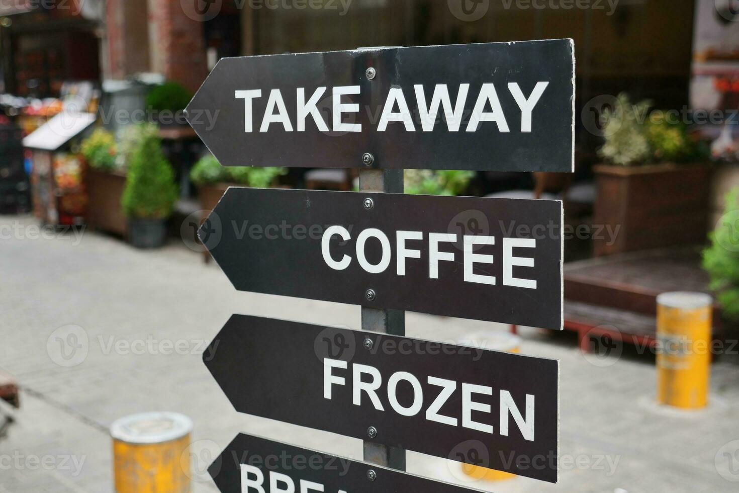 A sign at a coffee shop offering different types of coffee. photo