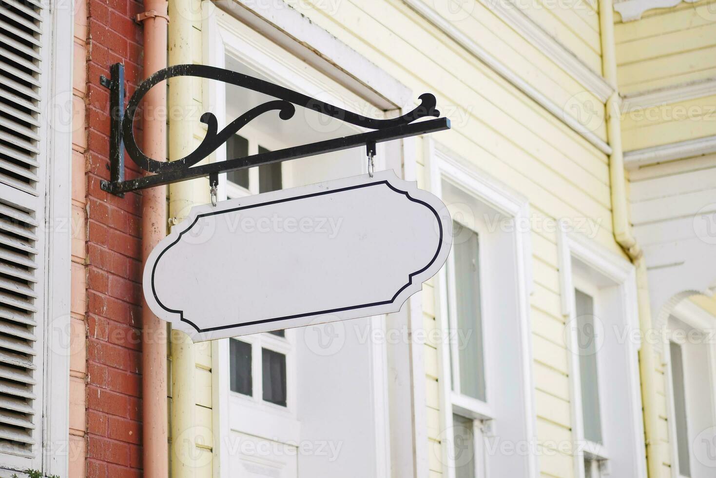 Street signboard mockup on modern city building photo