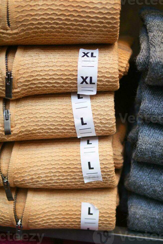 XL and L size clothing label tag. photo