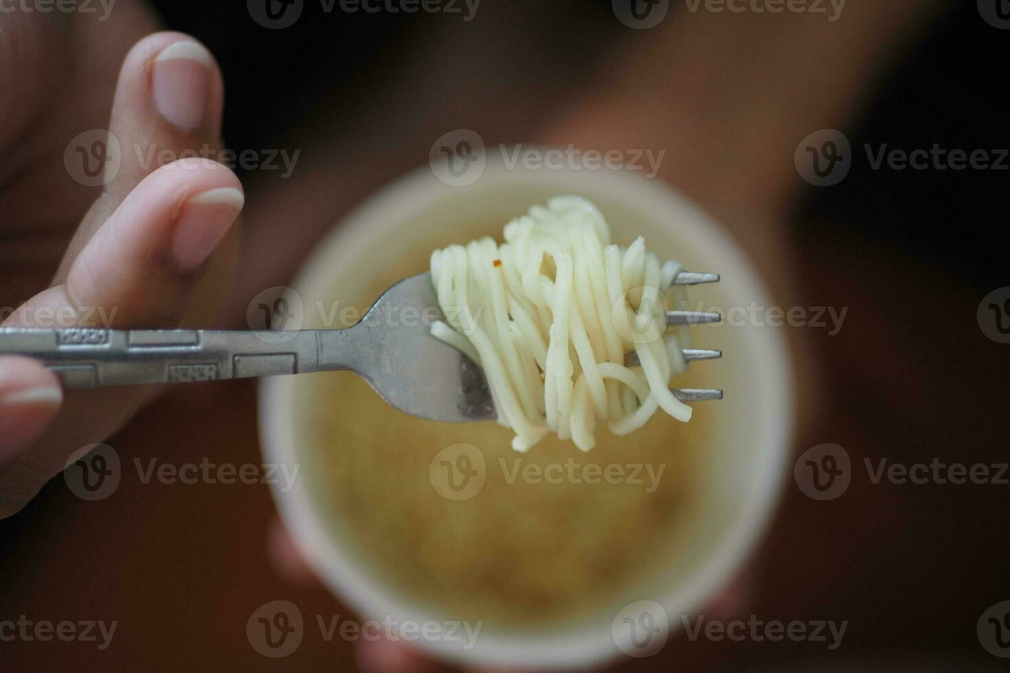 top view of eating instant cup noodles photo