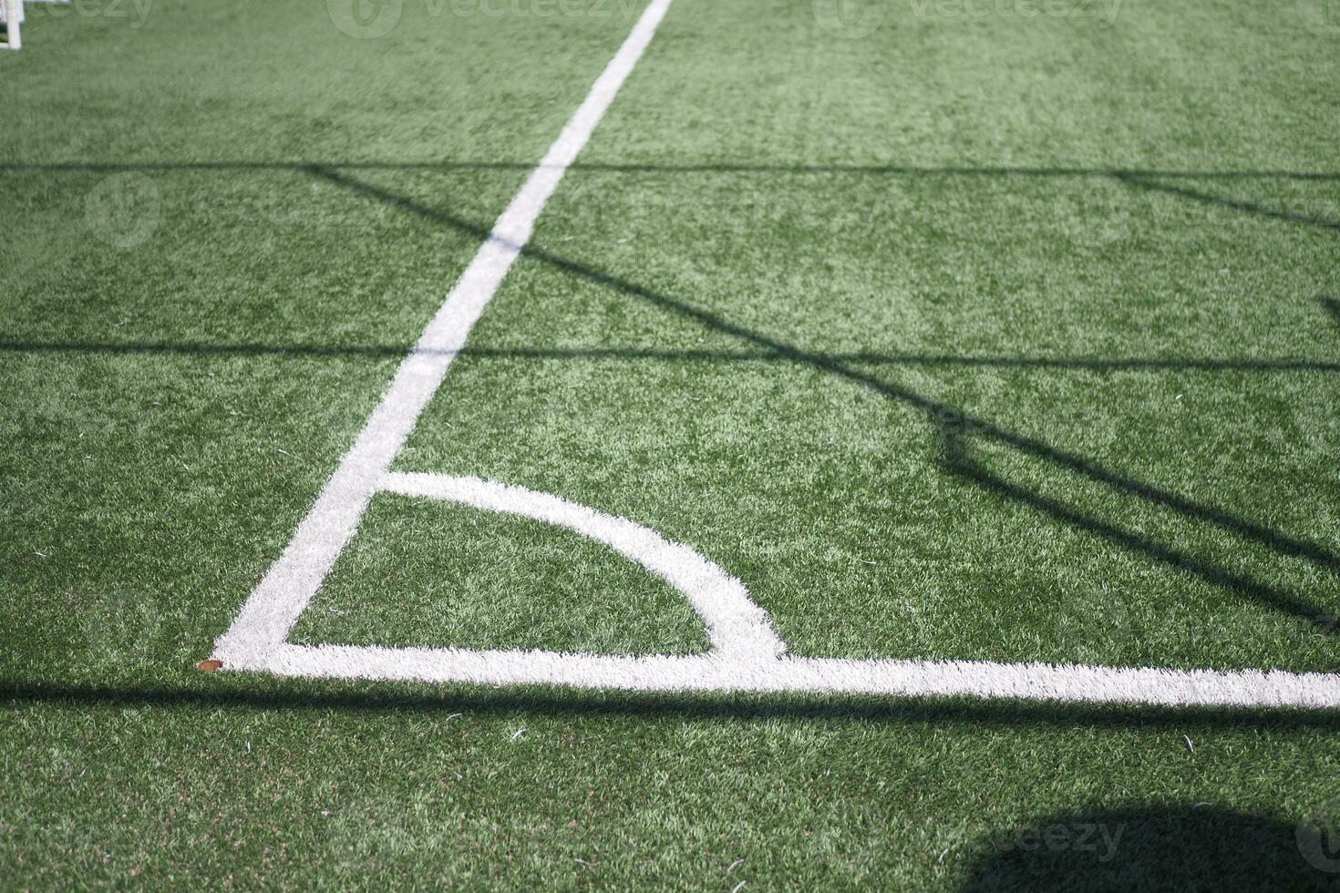 Closeup of Corner kick line of football and soccer field, background texture photo