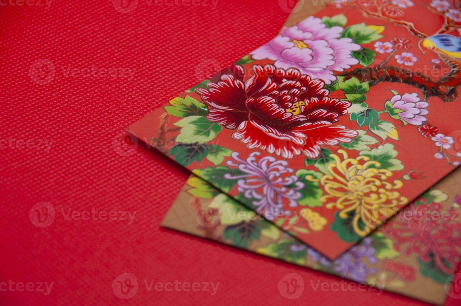 Close up of colorful envelope on red cover background with customizable space for text photo