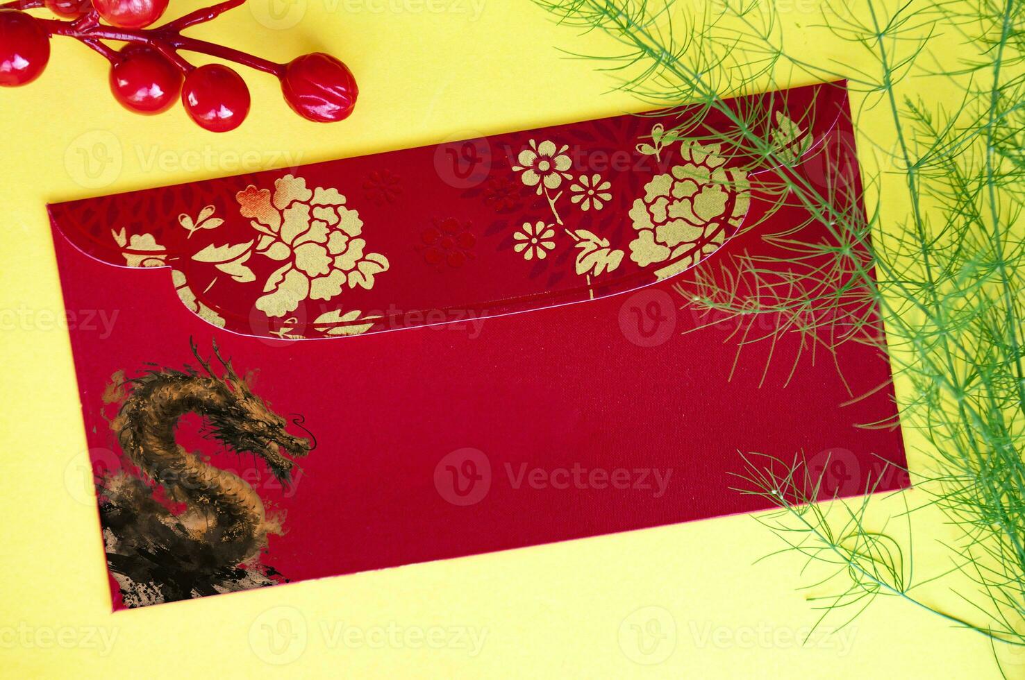 Top view of Chinese New Year red packet with golden dragon. Chinese New Year celebrations. photo