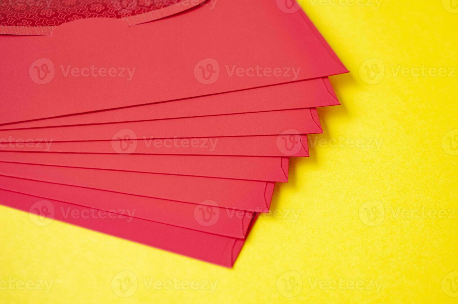 Red envelopes on yellow cover background with customizable space for text photo