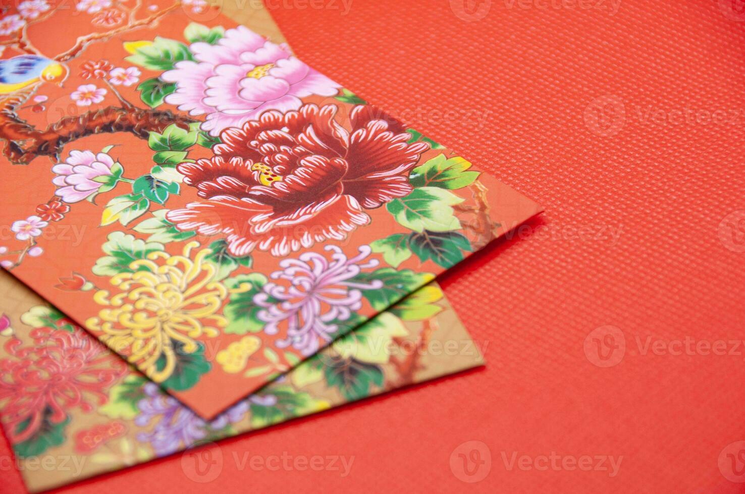 Close up of colorful envelope on red cover background with customizable space for text photo