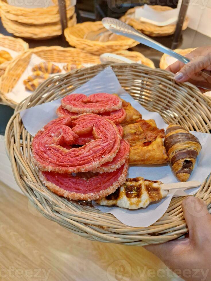 Image of choosing bread in a bakery photo
