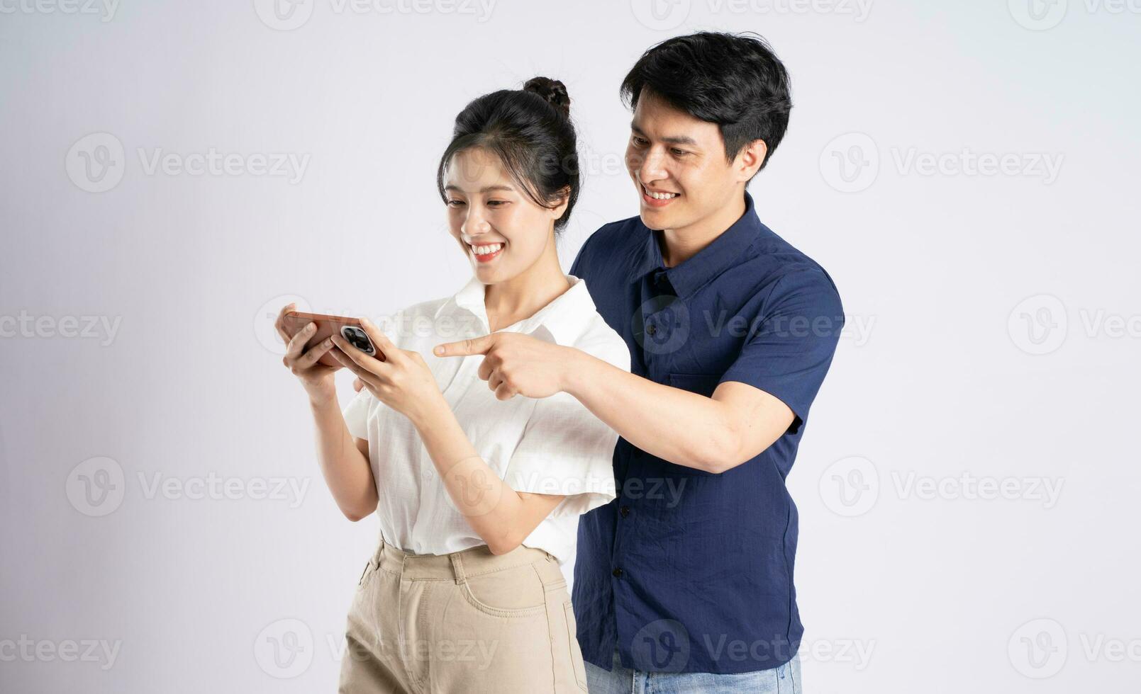 Image of an Asian couple posing on a white background photo