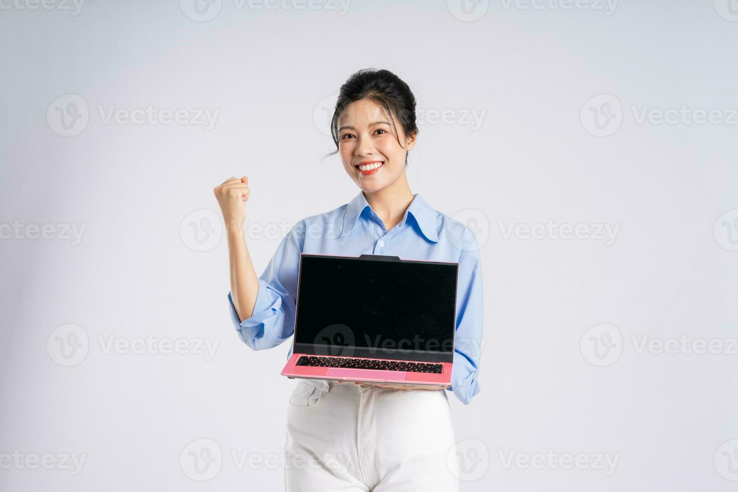 Portrait of young Asian businesswoman, isolated on white background photo