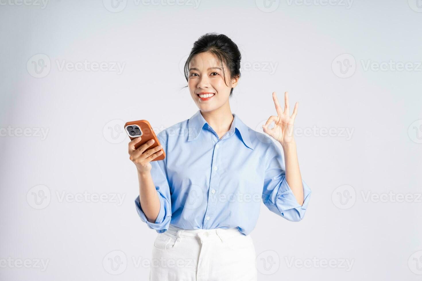 Portrait of young Asian businesswoman, isolated on white background photo