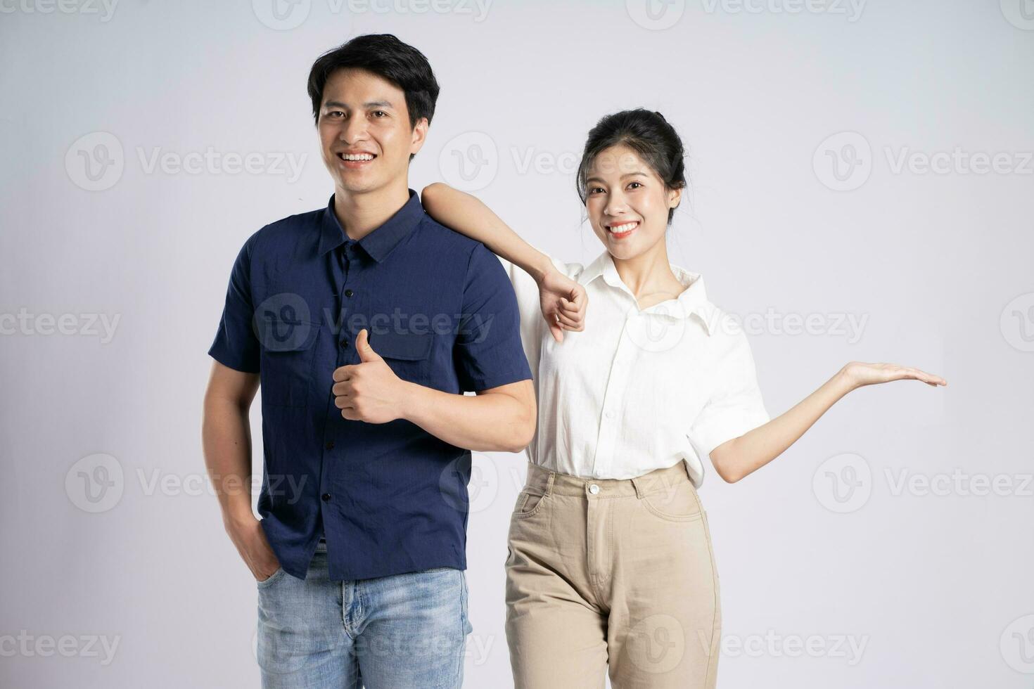 Image of an Asian couple posing on a white background photo