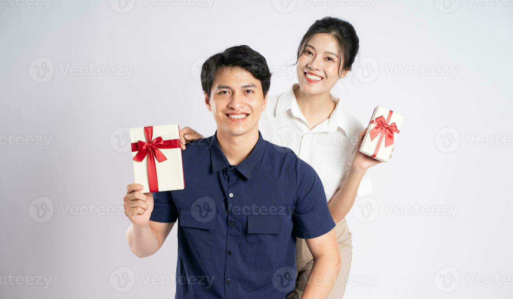 Image of an Asian couple posing on a white background photo