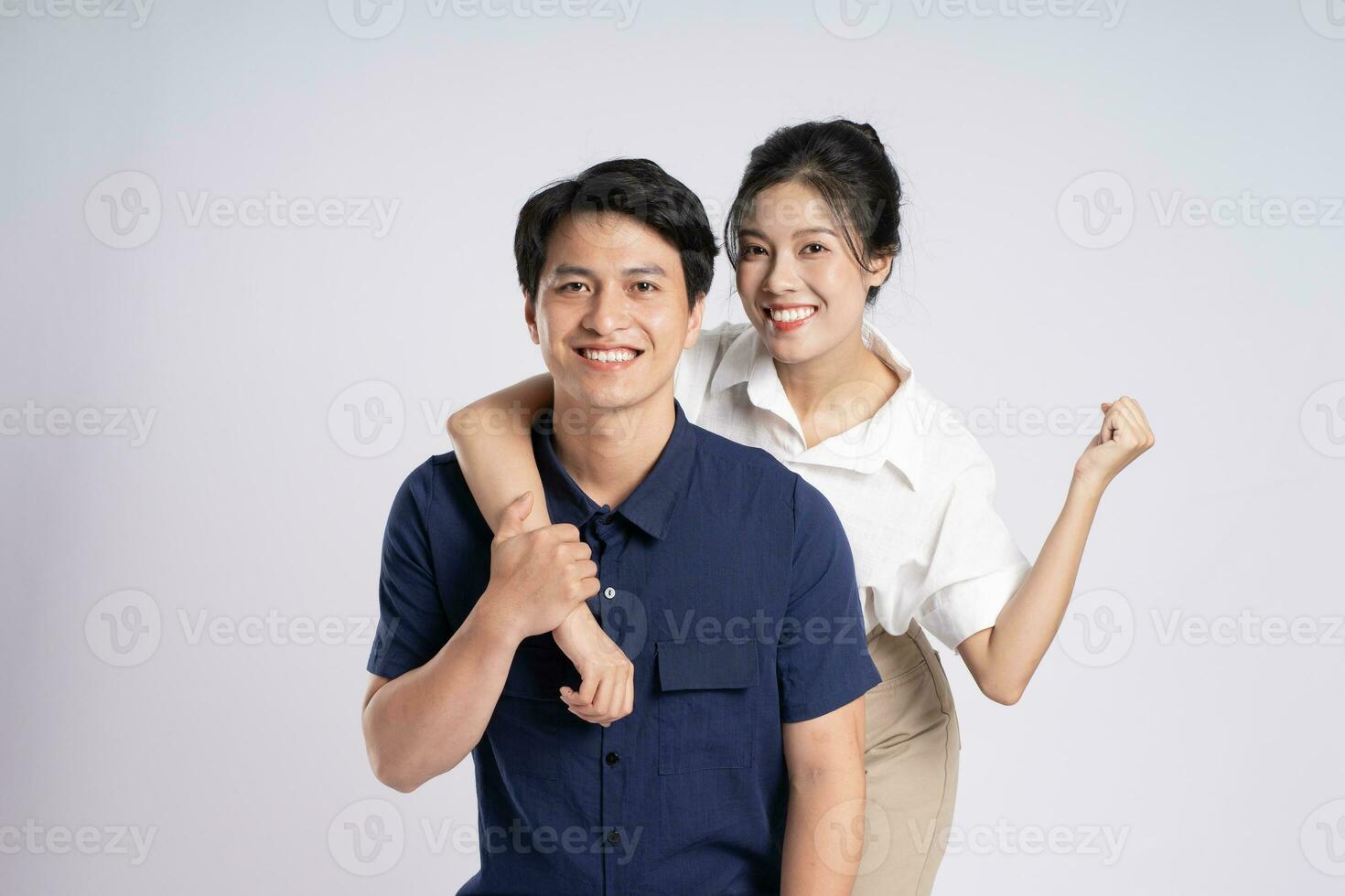 Image of an Asian couple posing on a white background photo