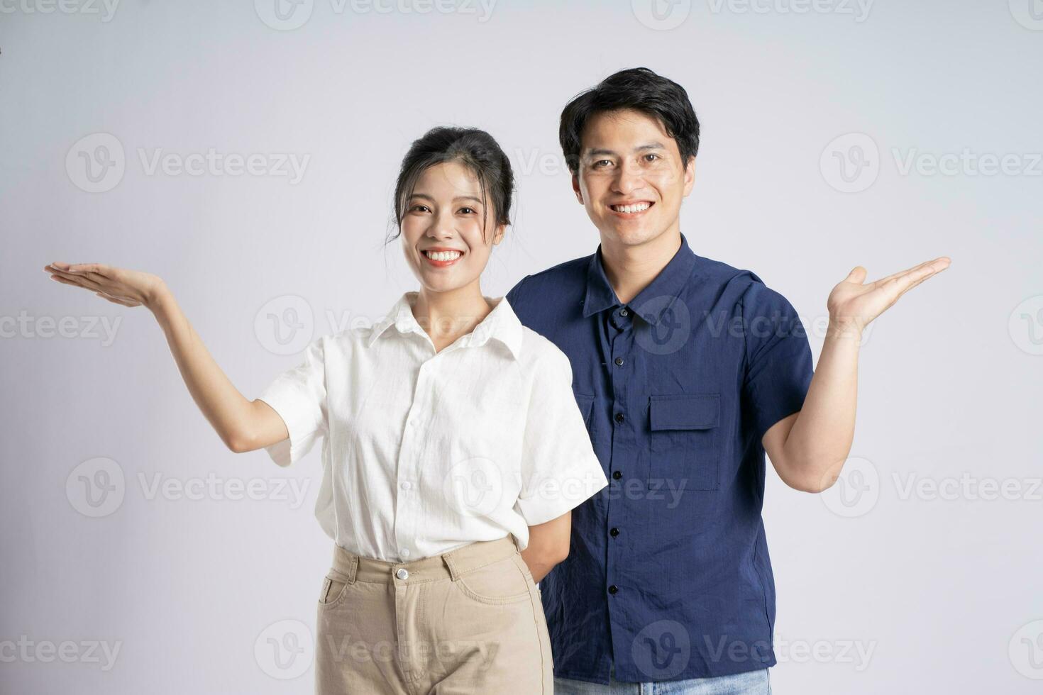 Image of an Asian couple posing on a white background photo