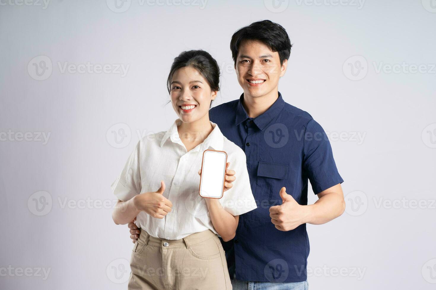 Image of an Asian couple posing on a white background photo