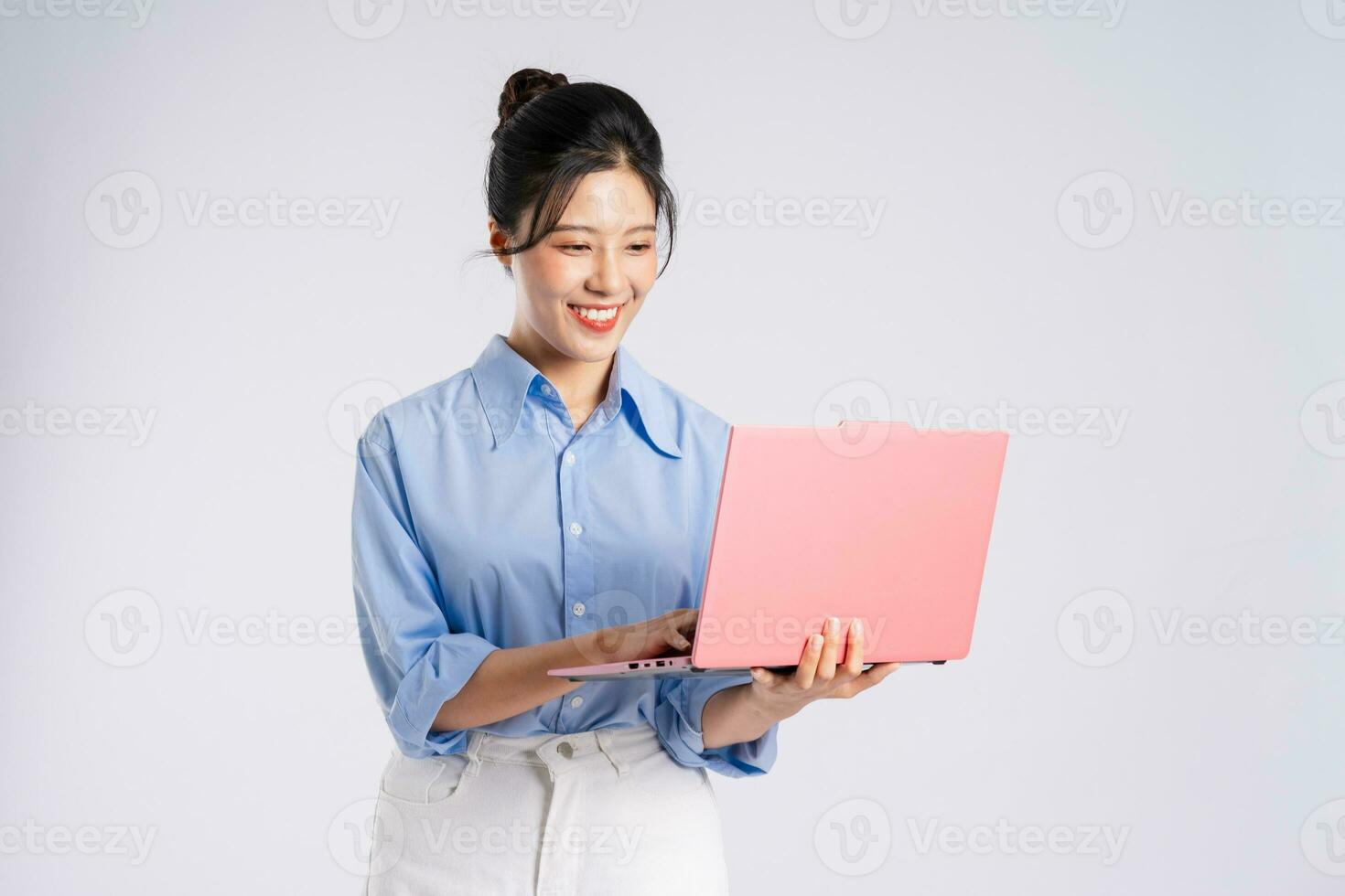 Portrait of young Asian businesswoman, isolated on white background photo