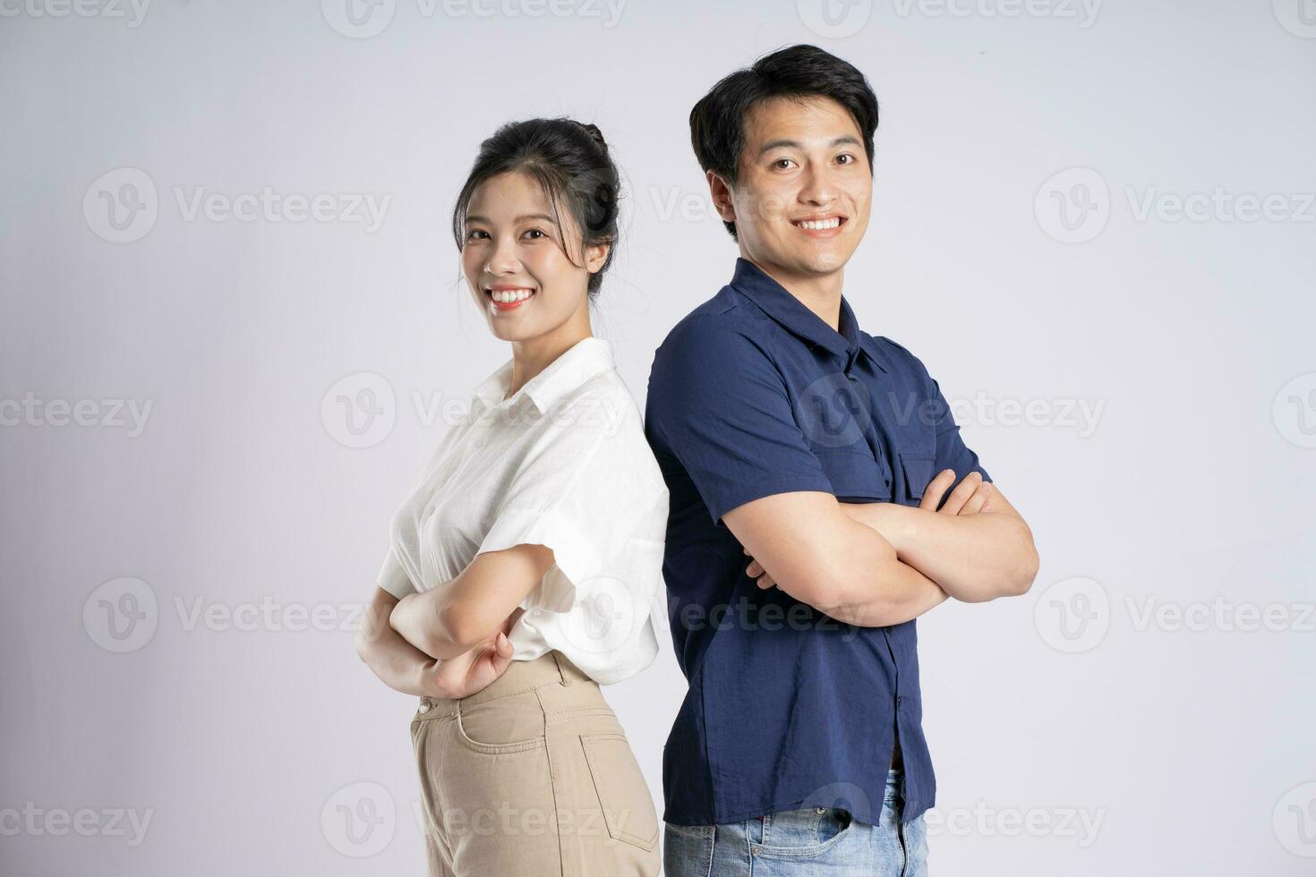 Image of an Asian couple posing on a white background photo