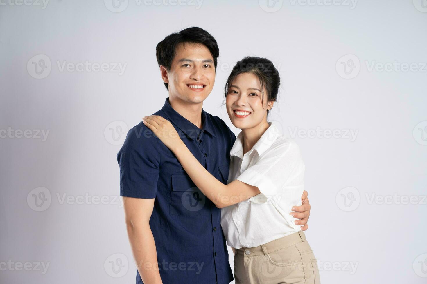 Image of an Asian couple posing on a white background photo