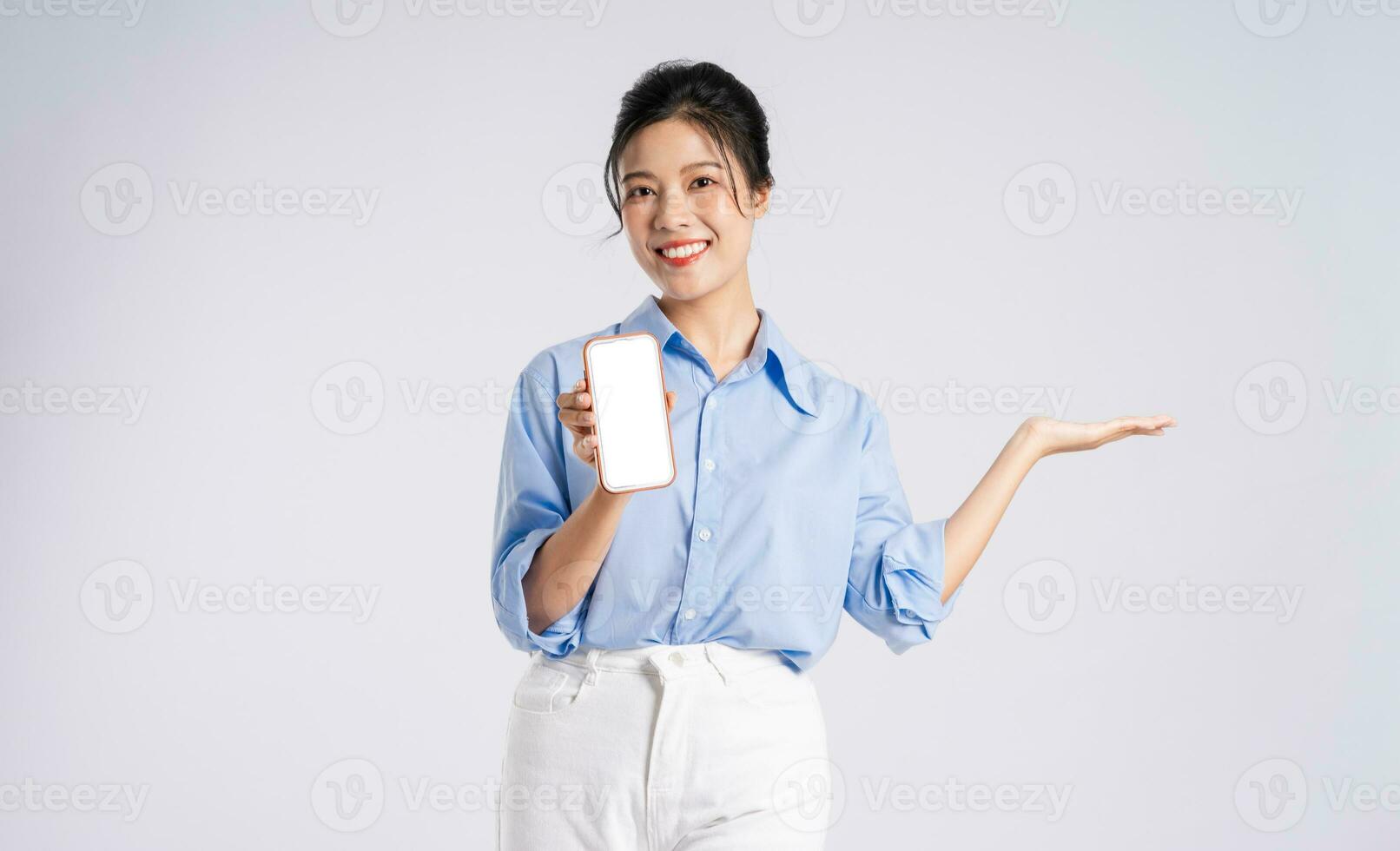 Portrait of young Asian businesswoman, isolated on white background photo