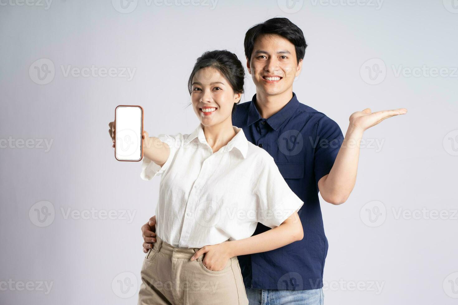 Image of an Asian couple posing on a white background photo