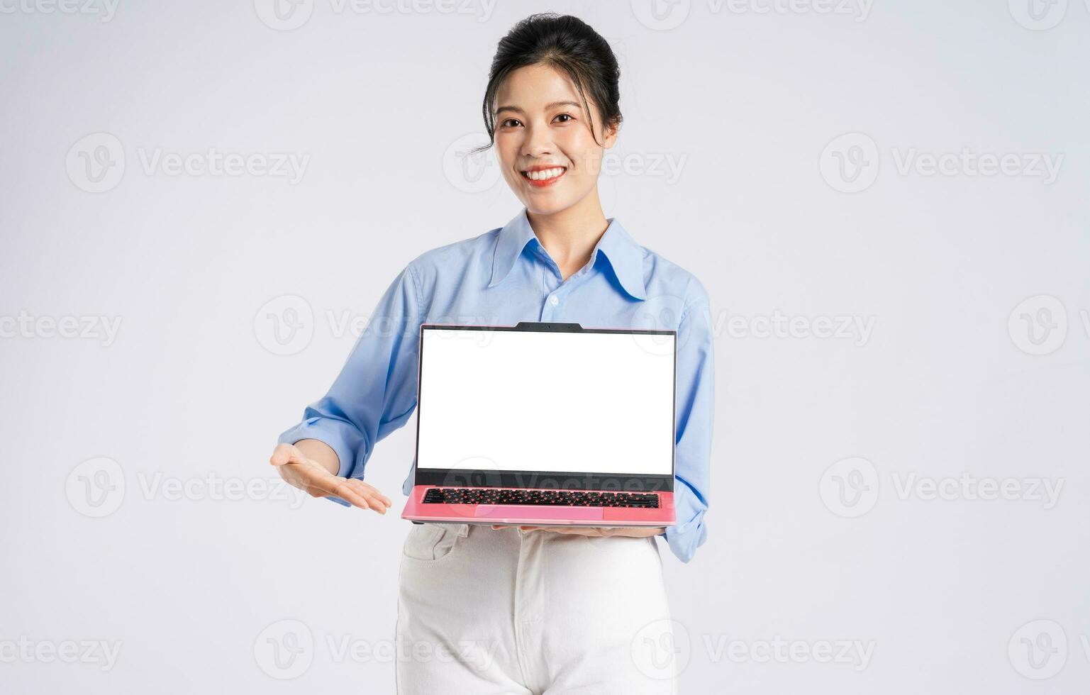 Portrait of young Asian businesswoman, isolated on white background photo