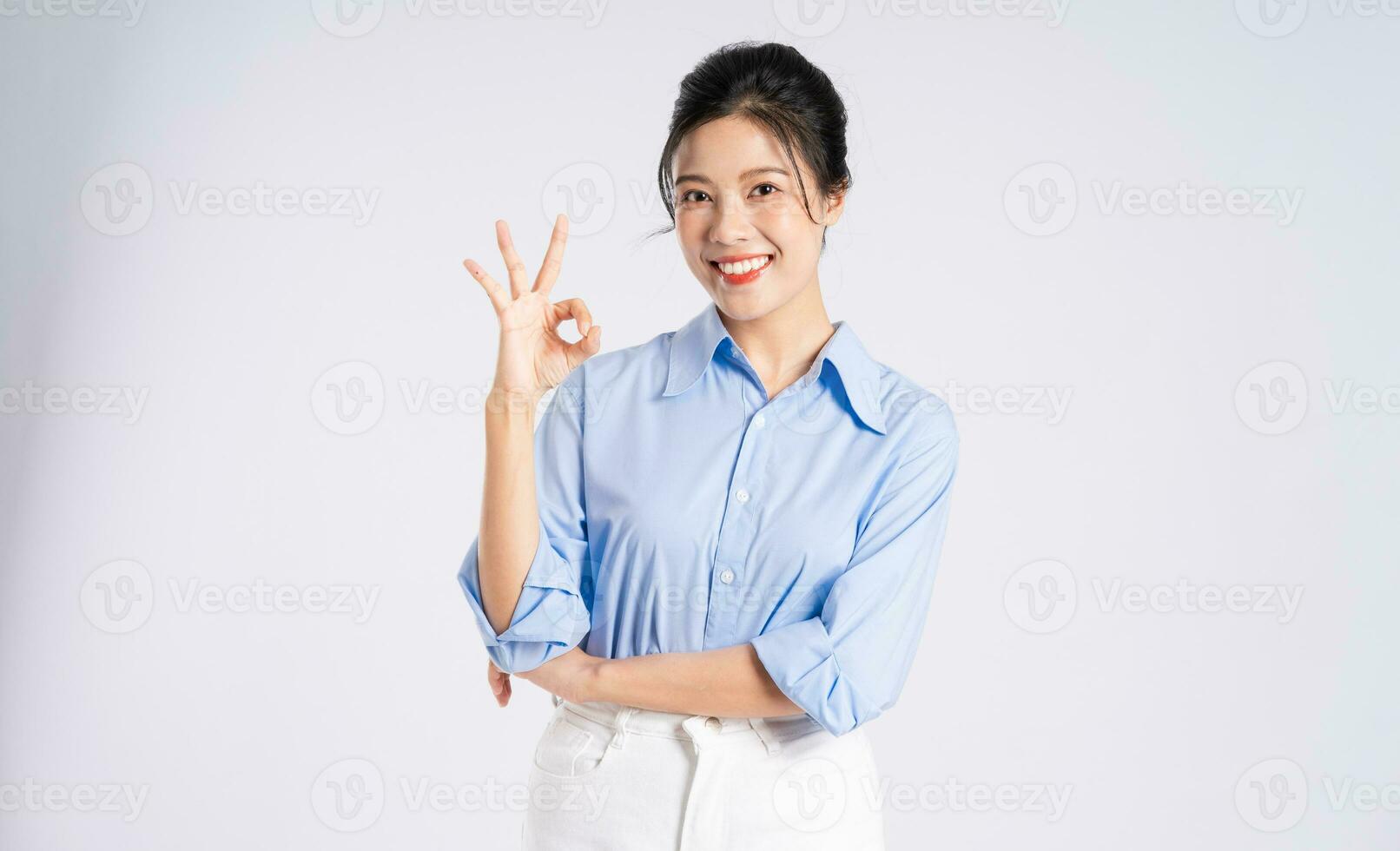 Portrait of young Asian businesswoman, isolated on white background photo