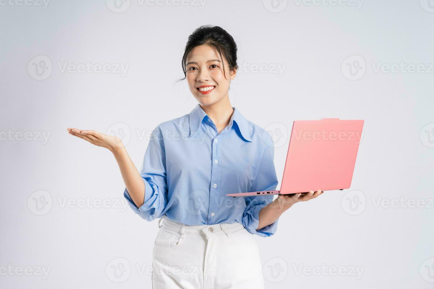 Portrait of young Asian businesswoman, isolated on white background photo