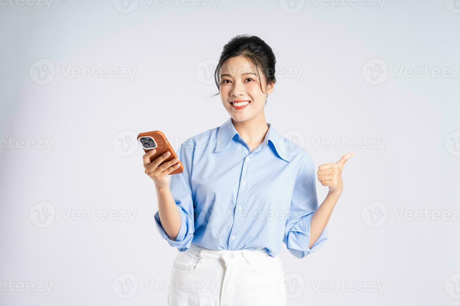 Portrait of young Asian businesswoman, isolated on white background photo