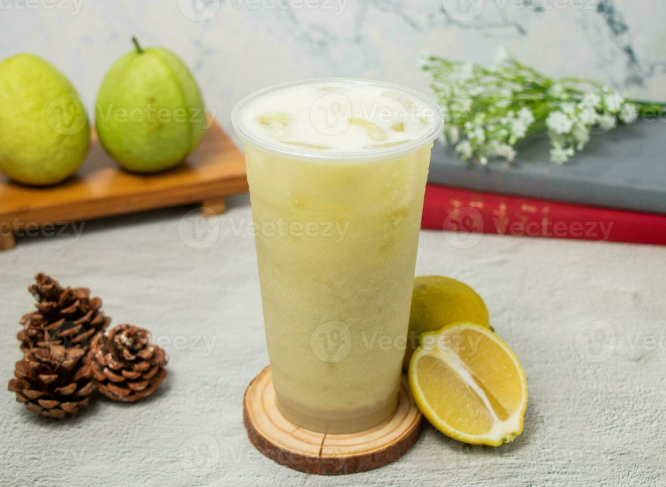 Guava Lemonade iced tea served in disposable glass isolated on background top view of taiwan drink photo