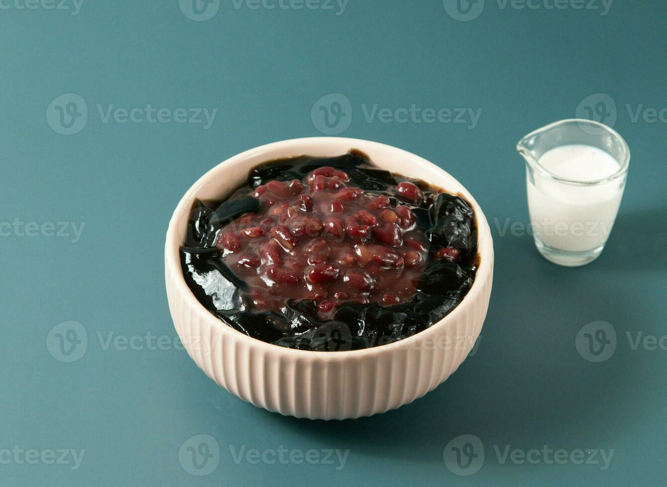Red Bean Panna Cotta served in bowl isolated on background top view of taiwan food photo