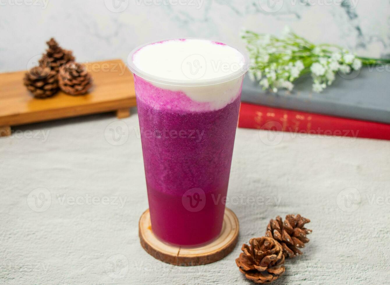 Dragon Cheese Milk ice tea served in disposable glass isolated on background top view of taiwan drink photo
