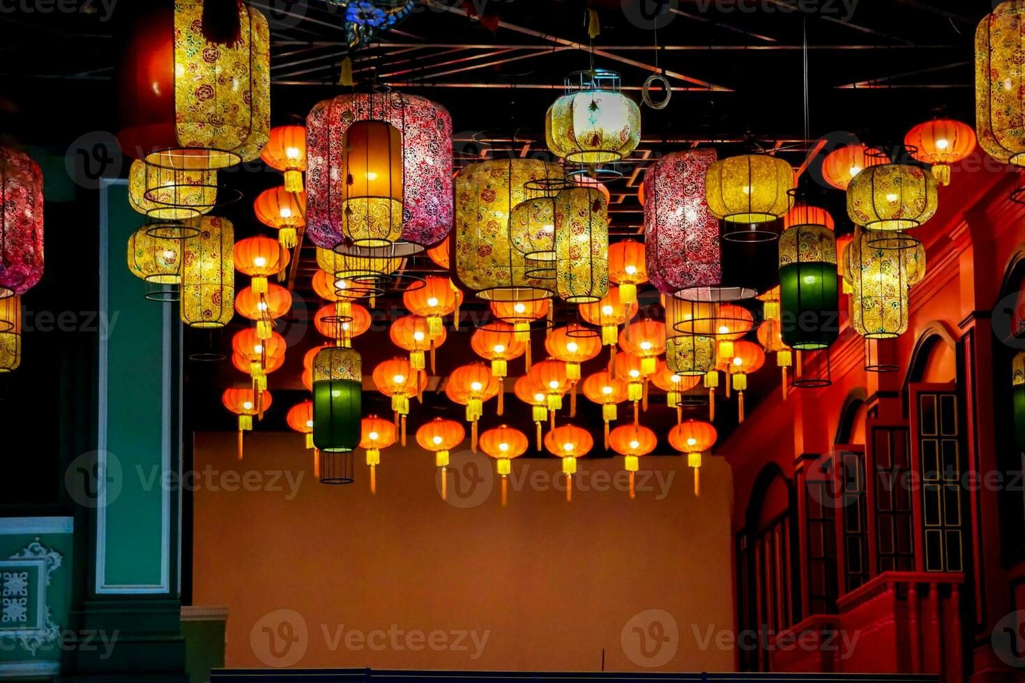 Decorative Chinese paper lantern hang on hotel lobby ceiling background with open lights on photo