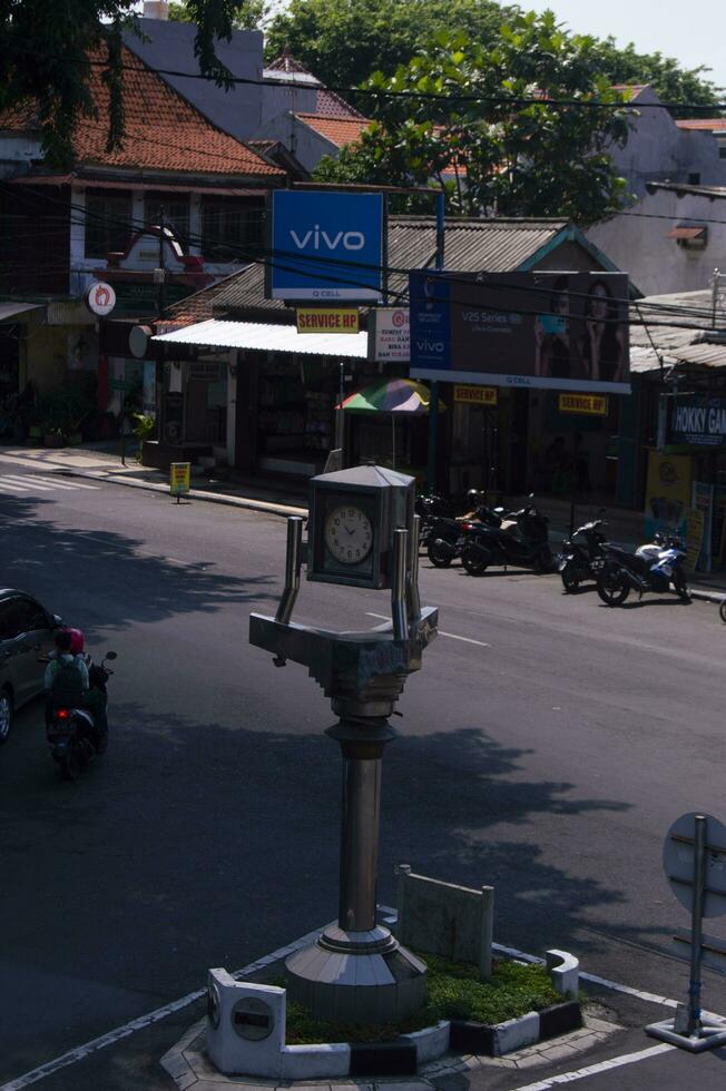 gresik, indonesia, 2022 - selective focus on the clock monument at the crossroads photo