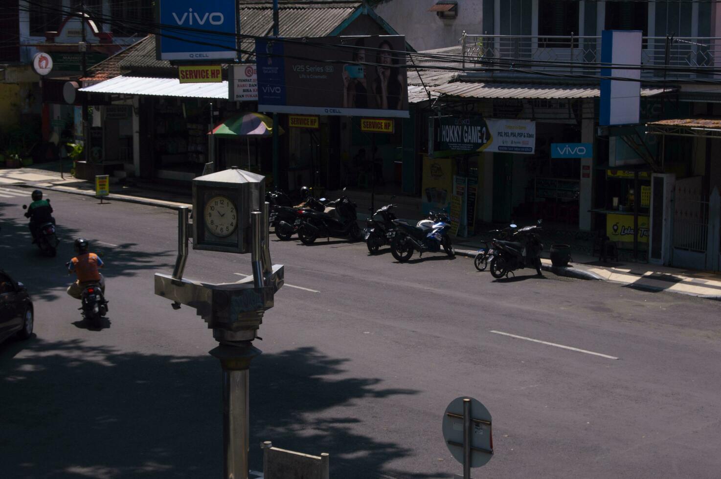 gresik, indonesia, 2022 - selective focus on the clock monument at the crossroads photo