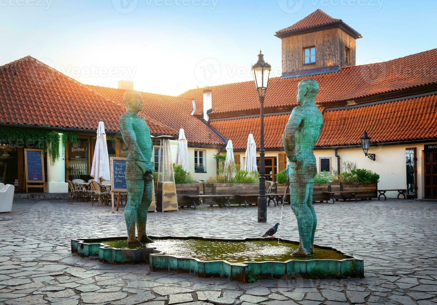 Pissing men statues in Prague photo