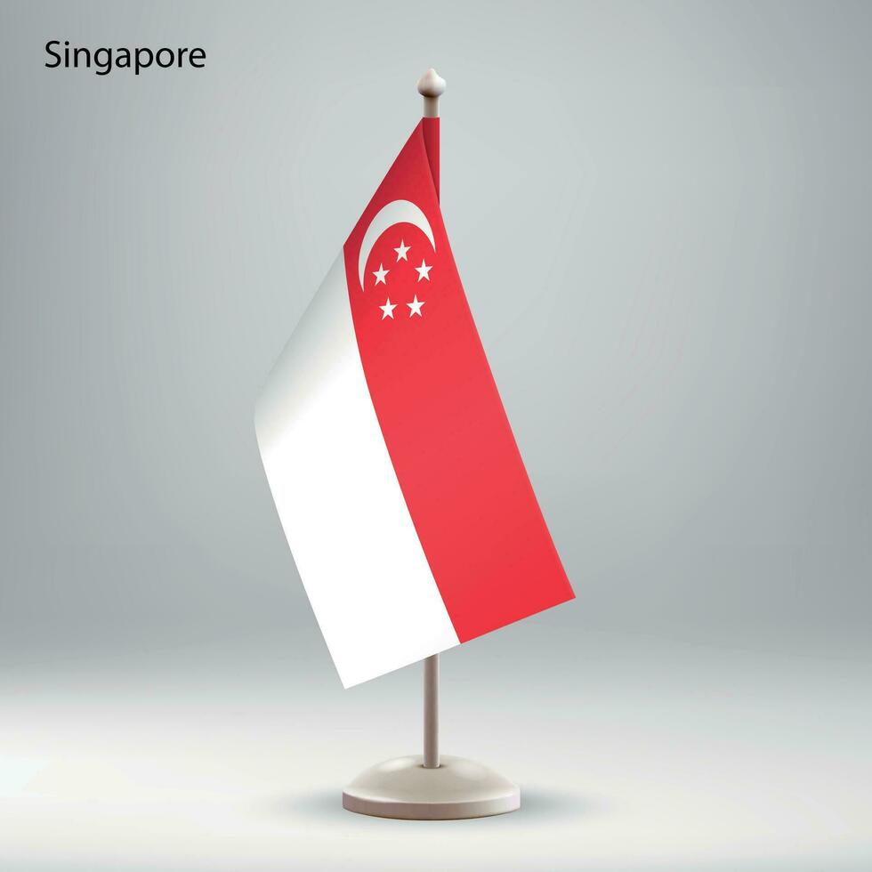 Flag of Singapore hanging on a flag stand. vector