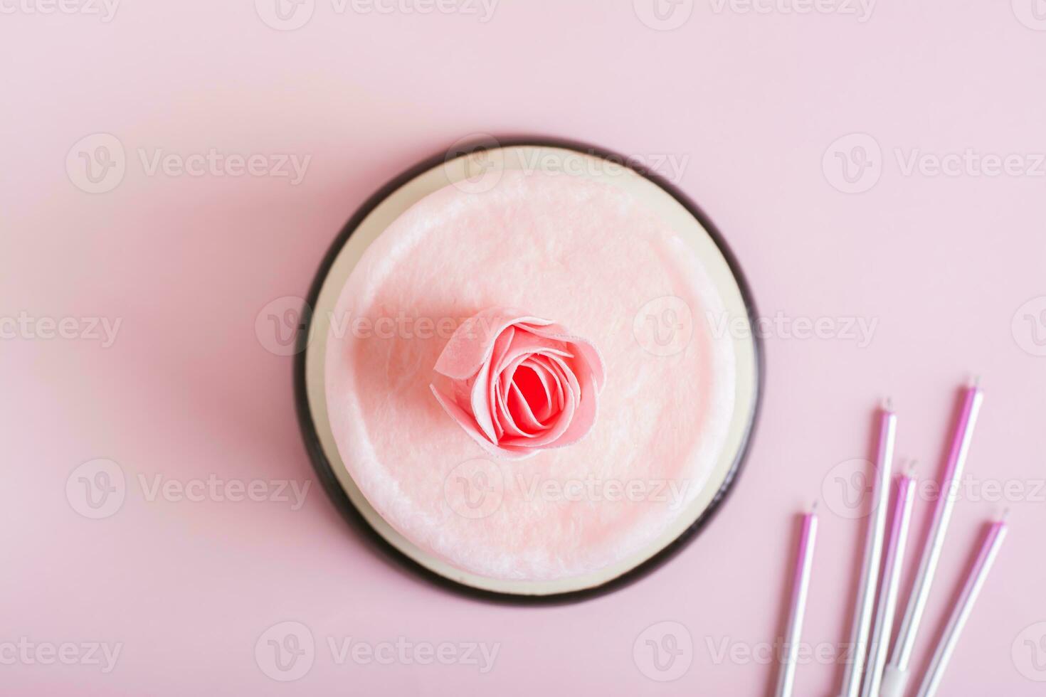 Close up of cotton candy cake and party decorations on the table top view photo