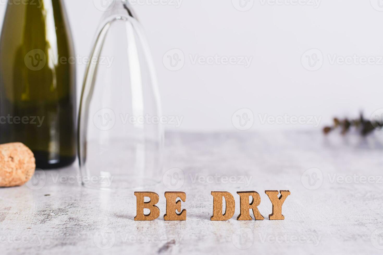 Sober January concept, text, glass, bottle and cork on the table photo