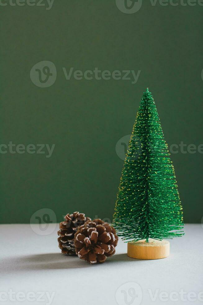 Christmas decorative spruce and pine cones on a green background vertical view photo