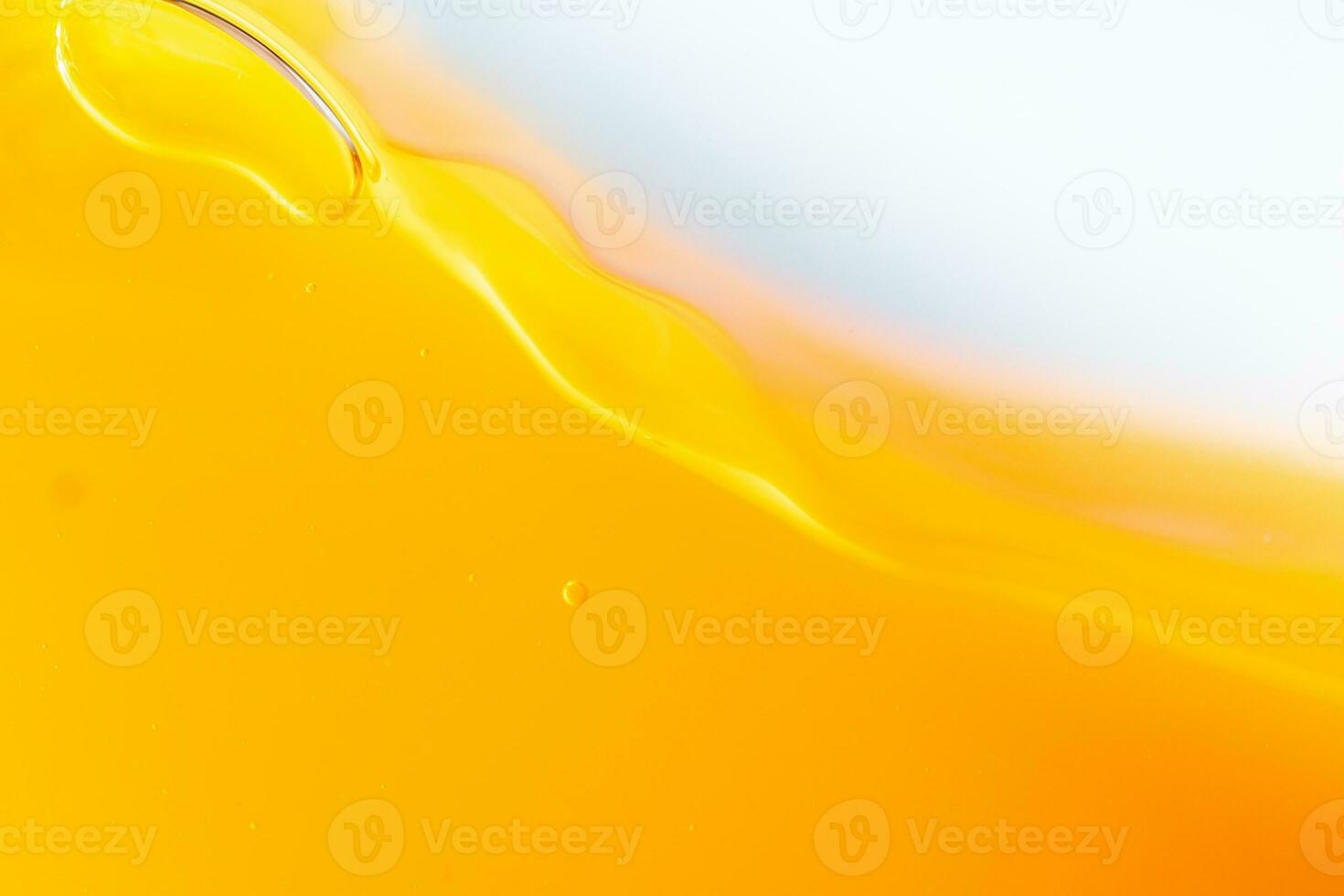 Close up bright orange juice splash texture for health and nature waves, Beautiful waves curve and little bubbles smooth for garphic design and background photo