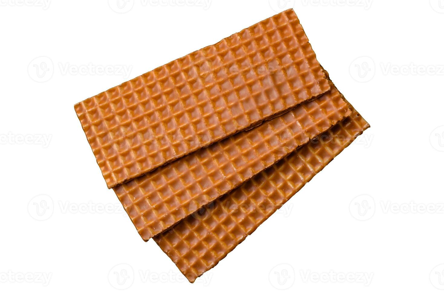 Delicious sweet crispy rectangular waffles on a ceramic plate photo