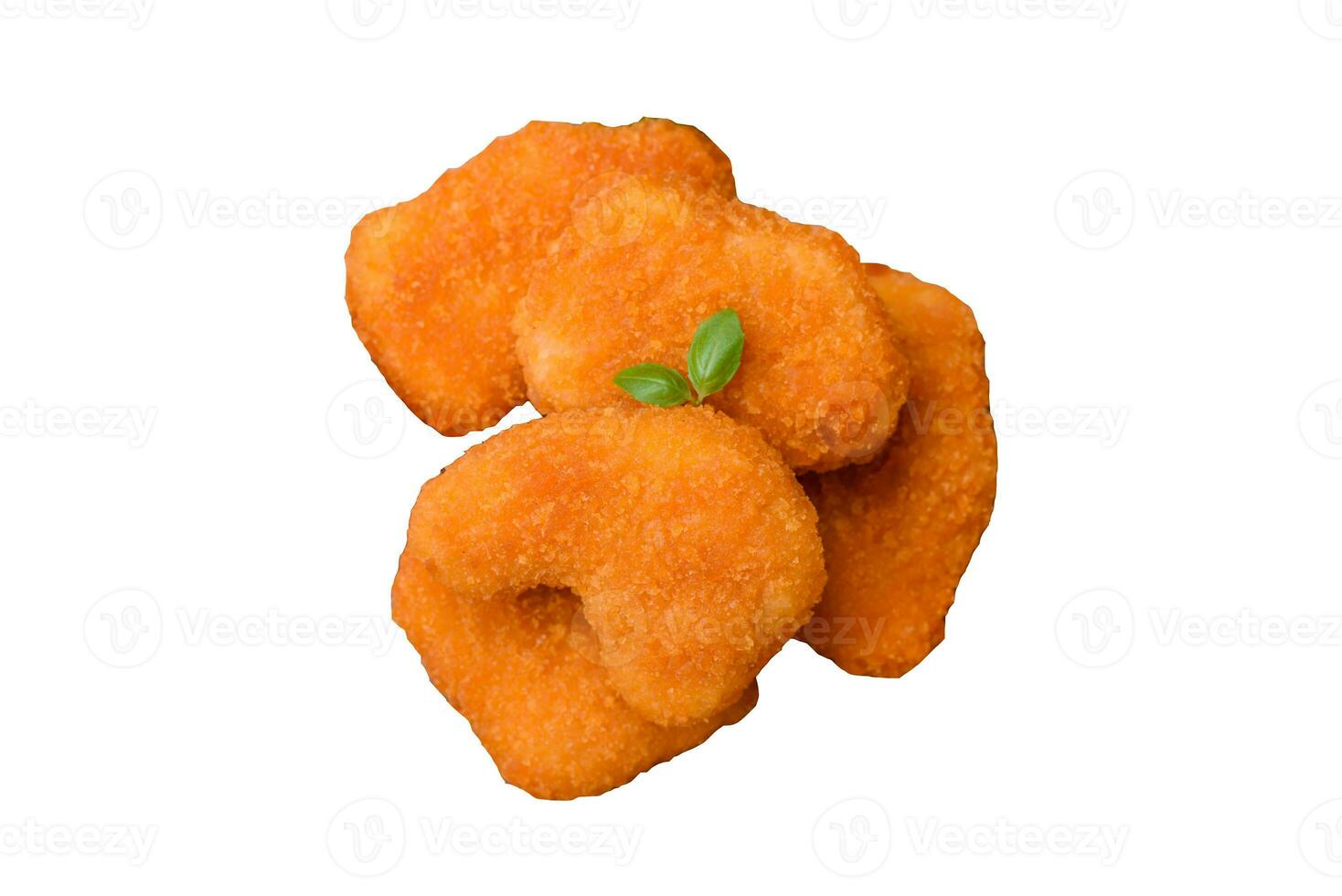 Delicious fresh crispy chicken nuggets on a dark concrete background photo
